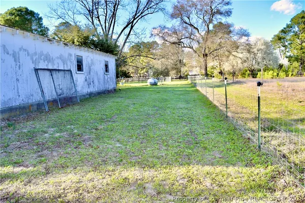 a backyard of a house with lots of green space