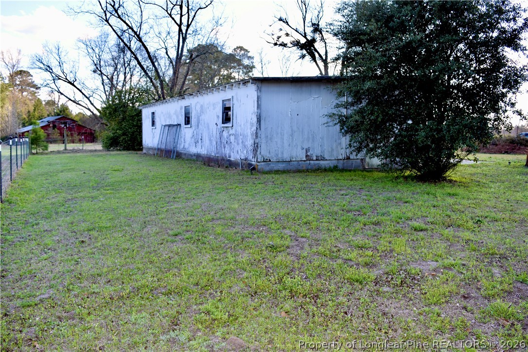 5271 Tobacco Road Orrum, NC 28369 - Photo 42 of 49 a backyard of a house with lots of green space