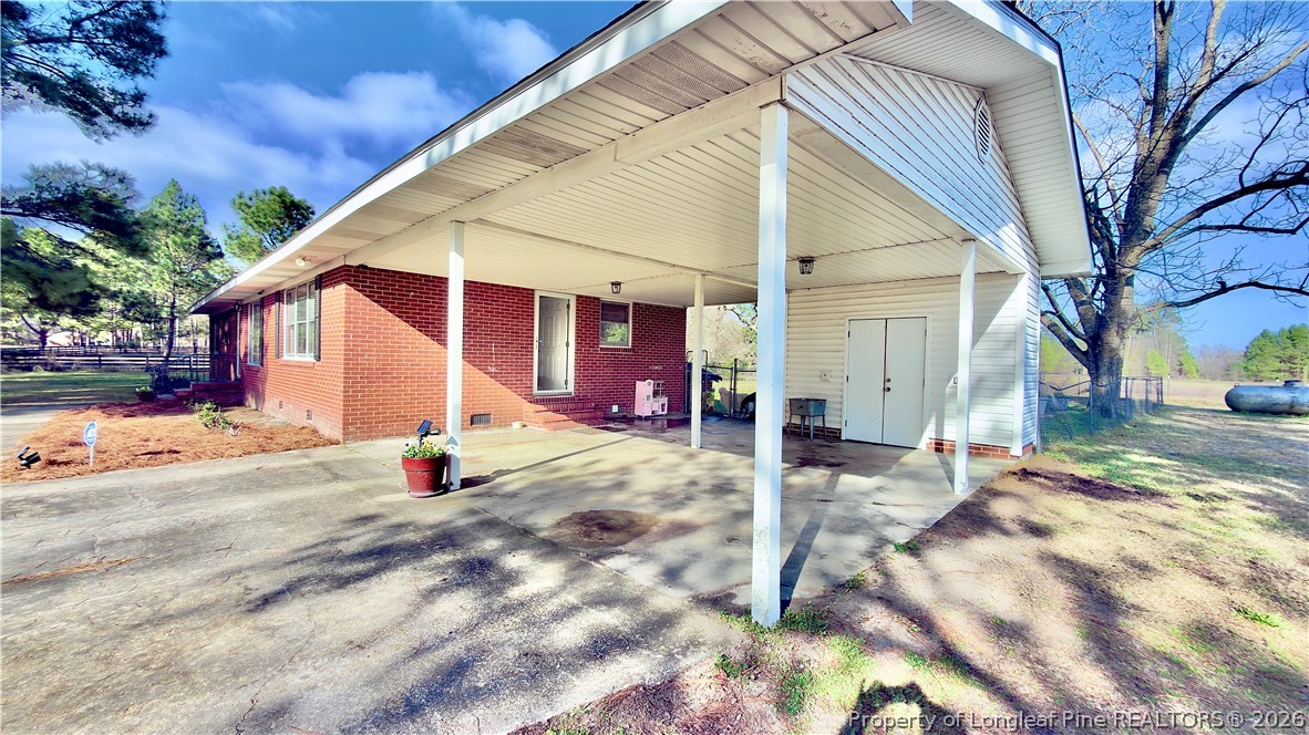 5271 Tobacco Road Orrum, NC 28369 - Photo 6 of 49 a view of a house with backyard and snow