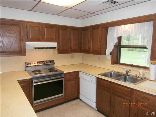 2639 Welshtown Road Slatington, PA 18080 - Photo 5 of 15 a kitchen with a stove and a sink
