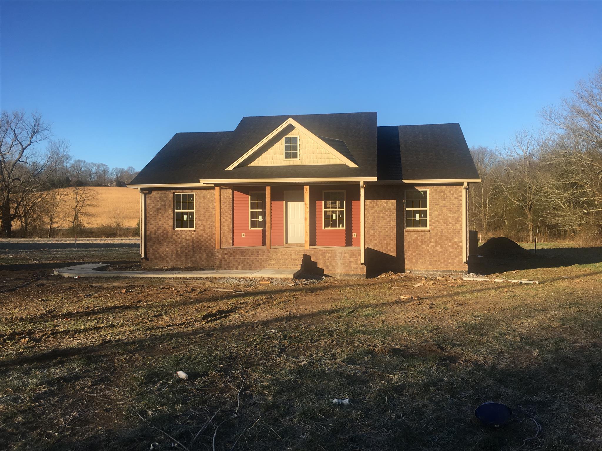 1909 Rock Bridge Road Bethpage, TN 37022 - Photo 1 of 4 a front view of a house with a yard
