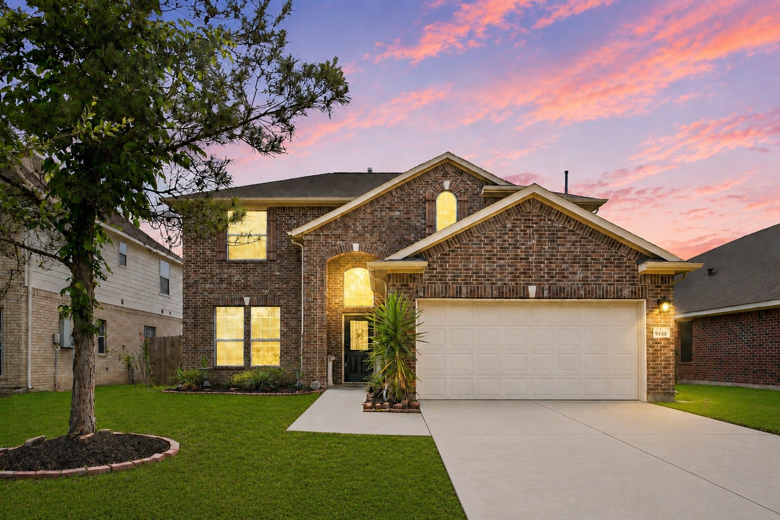 9438 Emerald Lakes Drive Rosharon, TX 77583 - Photo 1 of 36 a front view of a house with a garden and yard