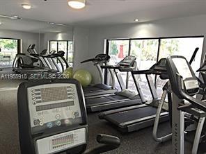 7743 Southwest 86th Street, Unit D227 Miami, FL 33143 - Photo 11 of 24 a view of a room with gym equipment