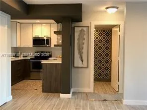 a kitchen with stainless steel appliances a refrigerator and a stove