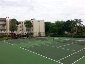 7743 Southwest 86th Street, Unit D227 Miami, FL 33143 - Photo 4 of 24 a view of a tennis court