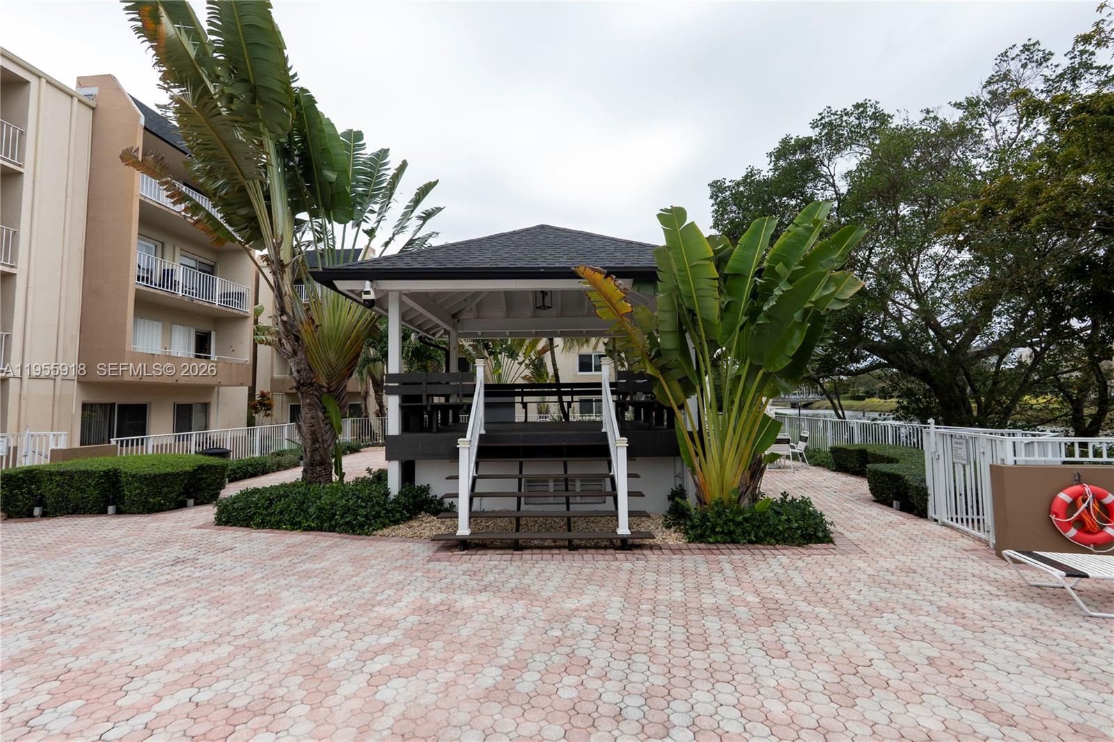 7743 Southwest 86th Street, Unit D227 Miami, FL 33143 - Photo 8 of 24 a front view of house with yard and green space