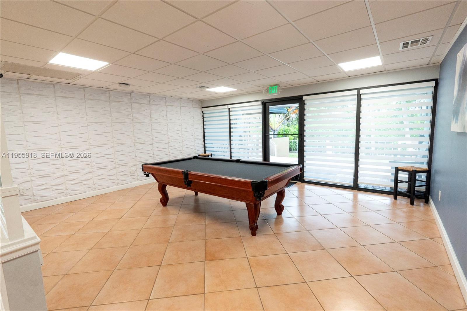 7743 Southwest 86th Street, Unit D227 Miami, FL 33143 - Photo 10 of 24 a living room with a table and a table