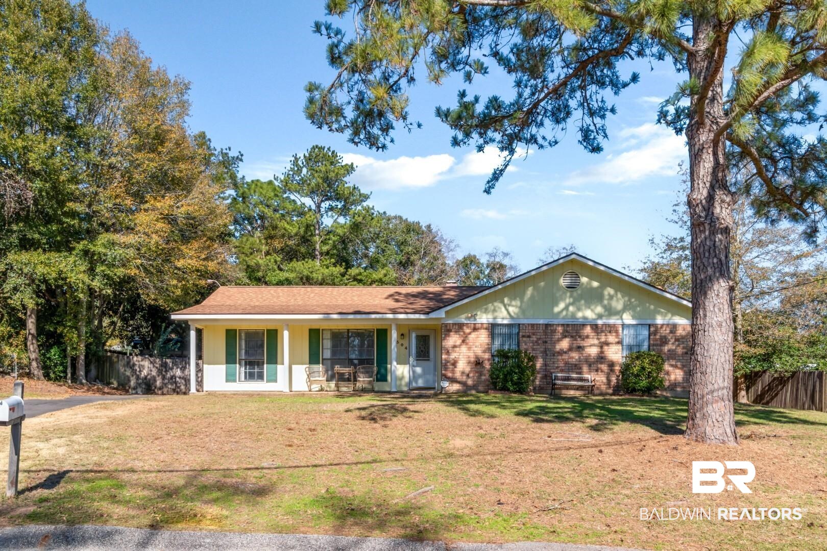 8304 Champlain Circle Mobile, AL 36695 - Photo 43 of 46 Ranch-style house featuring covered porch and a front lawn