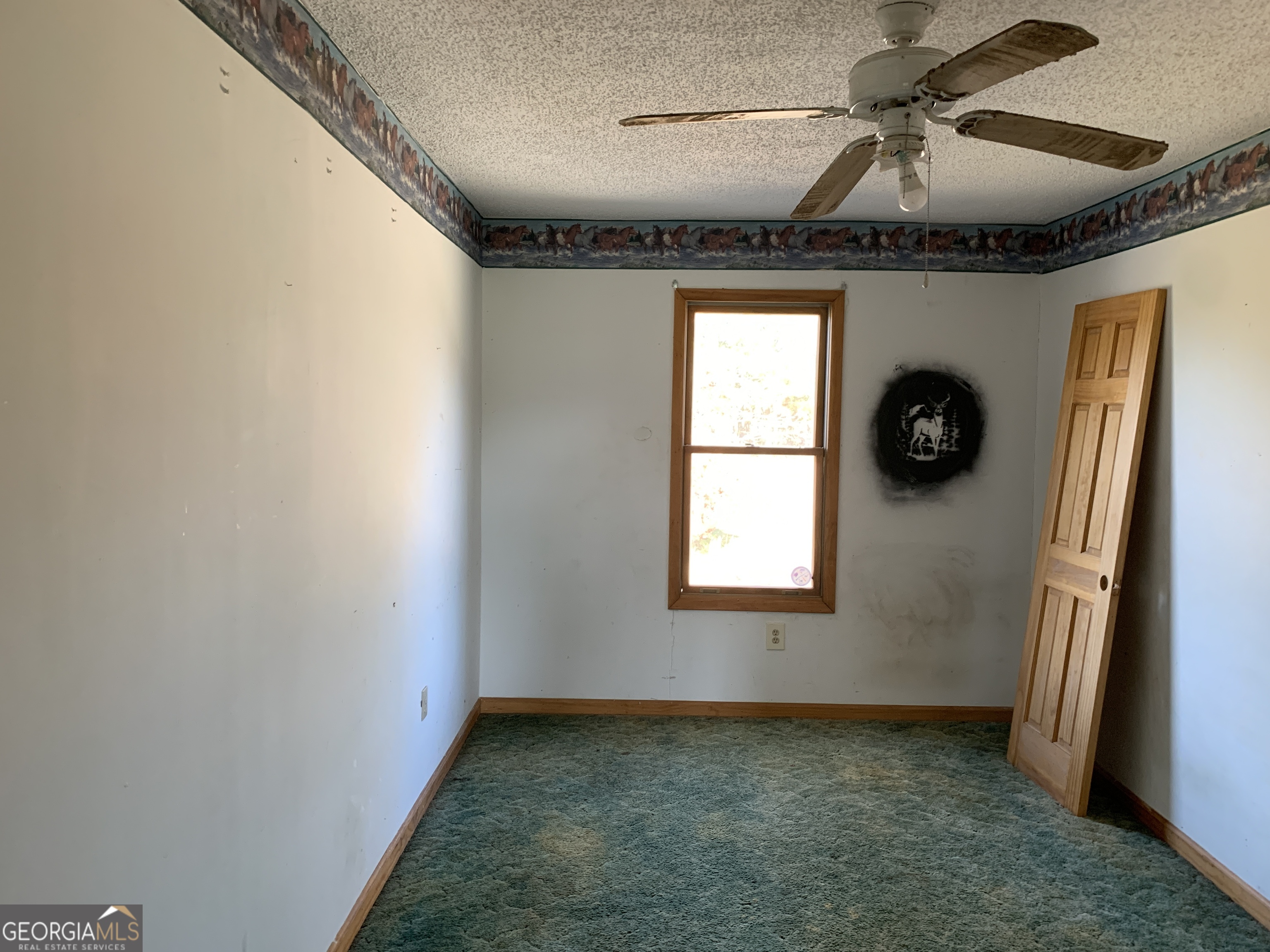 222 Reno Road Royston, GA 30662 - Photo 14 of 15 a view of a livingroom with a dishwasher and a window