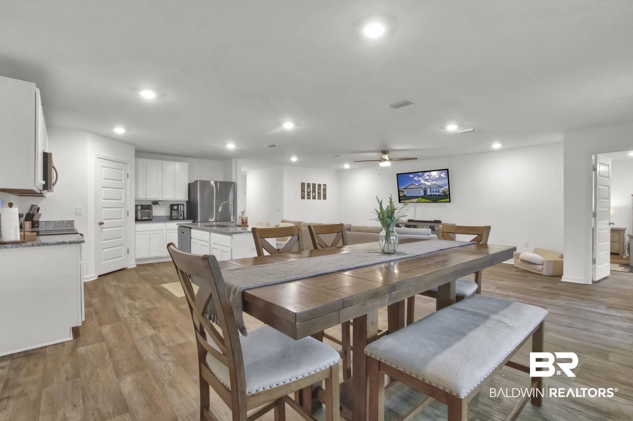 23810 Unbridled Loop Daphne, AL 36526 - Photo 7 of 50 Dining space featuring ceiling fan and light hardwood / wood-style flooring
