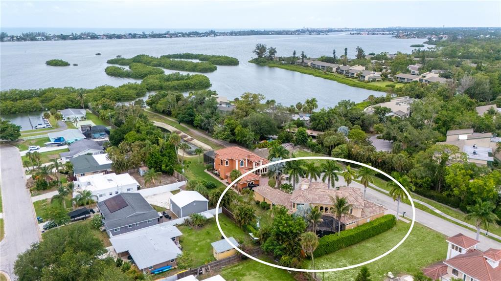 1630 Assisi Drive, Unit 18 Sarasota, FL 34231 - Photo 37 of 42 an aerial view of a house having yard