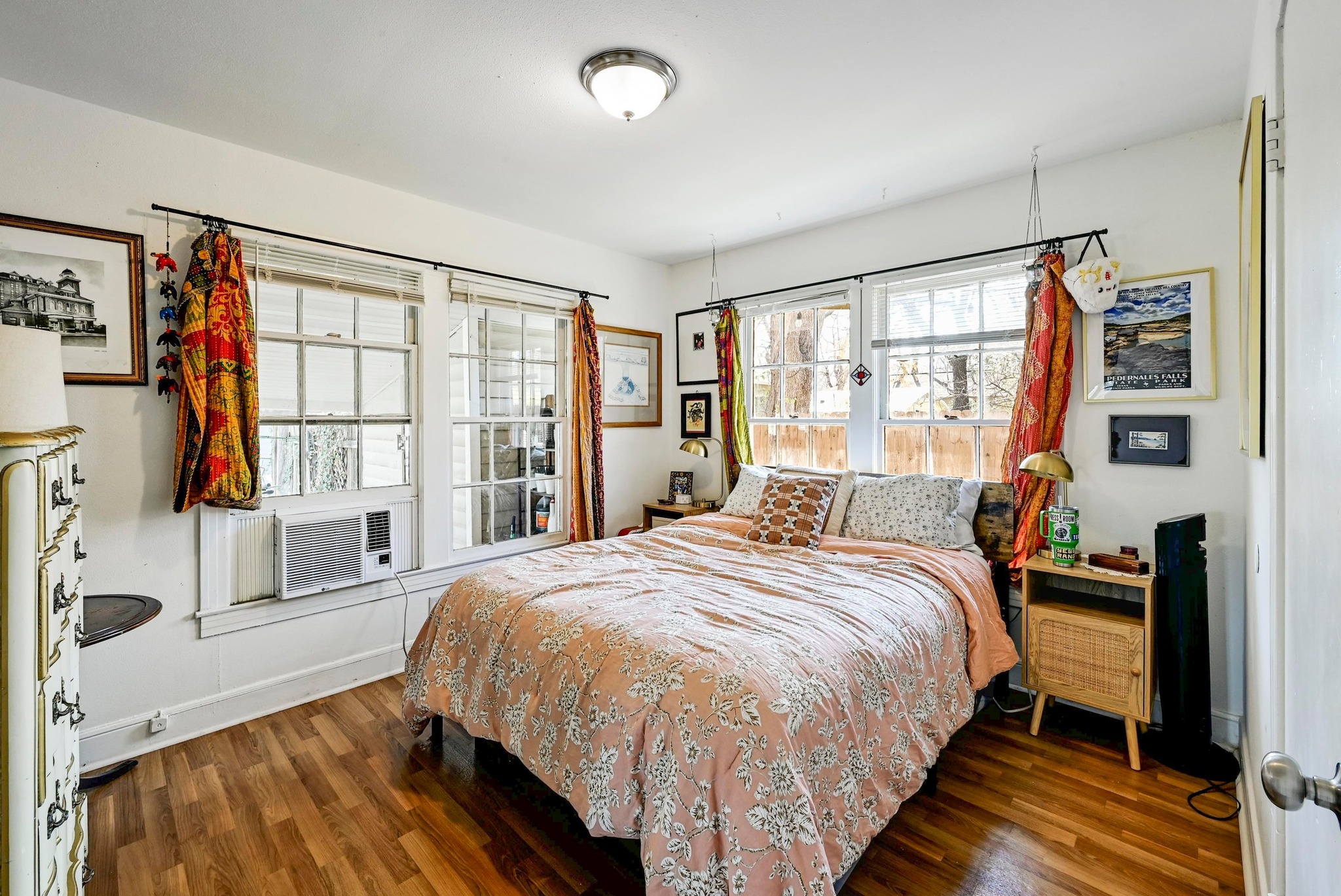 4530 Avenue D, Unit B Austin, TX 78751 - Photo 18 of 29 a bedroom with a bed and a large window with wooden floor