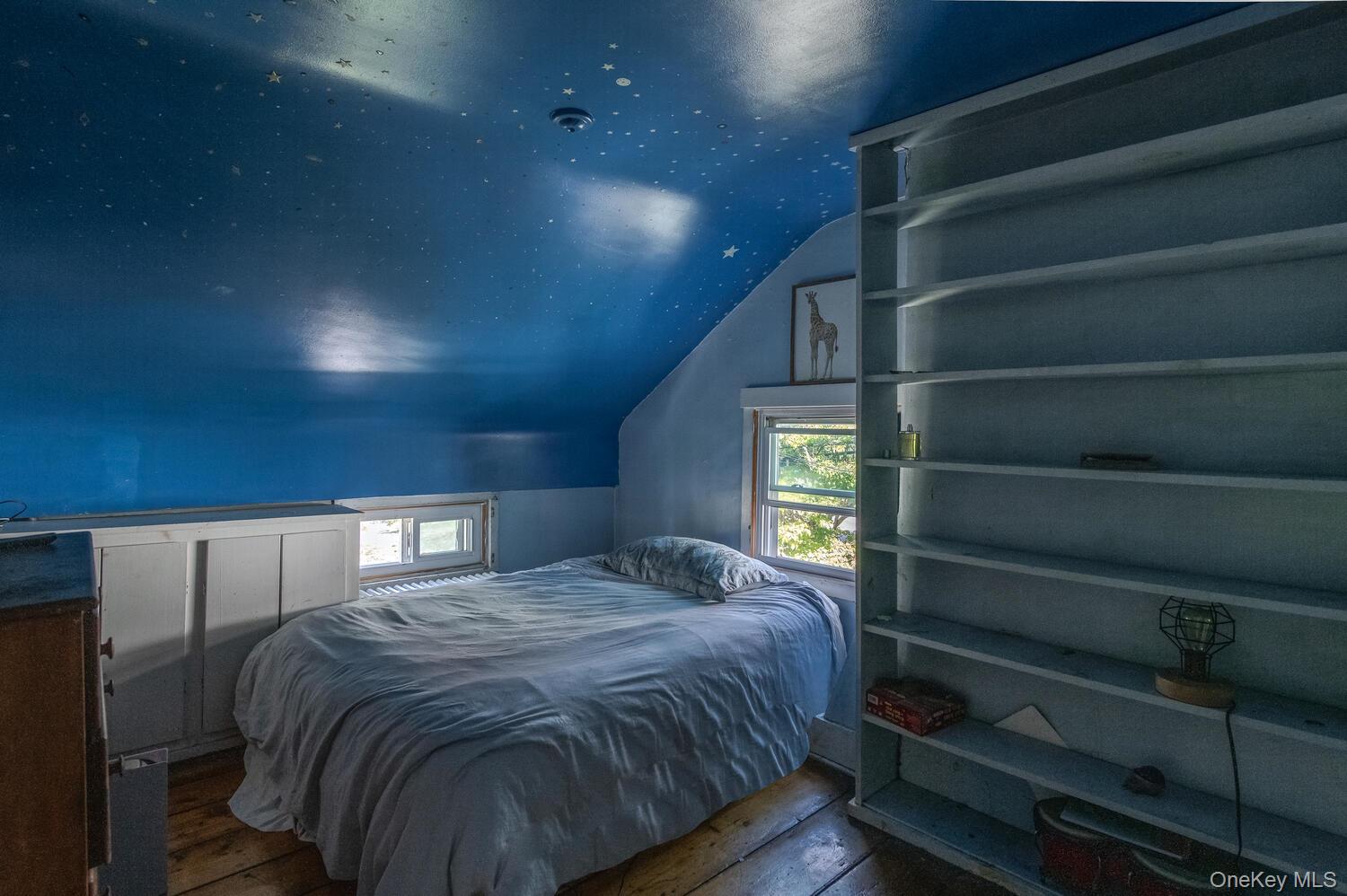 88 South Hamilton Street Poughkeepsie, NY 12601 - Photo 31 of 47 Bedroom featuring dark wood flooring, lofted ceiling, and multiple windows