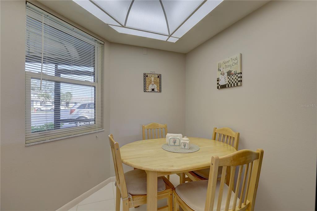 2131 Ridge Road South, Unit 132 Largo, FL 33778 - Photo 13 of 32 a view of a dining room with furniture and window