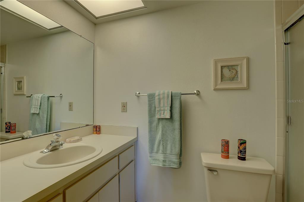 2131 Ridge Road South, Unit 132 Largo, FL 33778 - Photo 20 of 32 a bathroom with a sink and a mirror