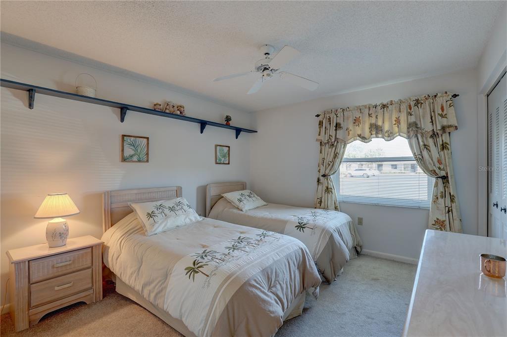 2131 Ridge Road South, Unit 132 Largo, FL 33778 - Photo 22 of 32 a bedroom with a bed and a window