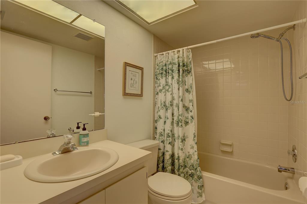 2131 Ridge Road South, Unit 132 Largo, FL 33778 - Photo 25 of 32 a bathroom with a sink toilet and shower