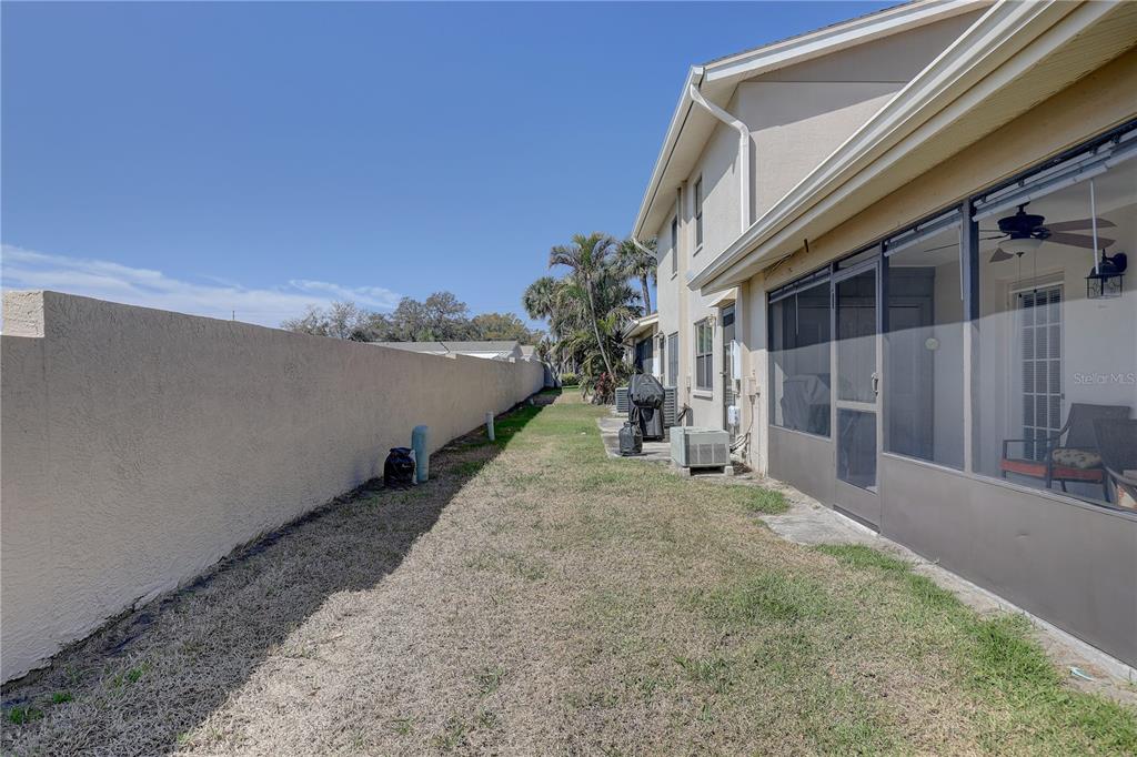 2131 Ridge Road South, Unit 132 Largo, FL 33778 - Photo 30 of 32 a view of a house with a backyard