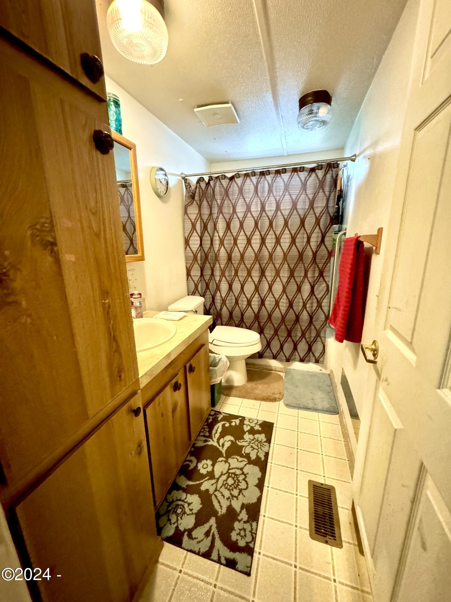 724 Southwest Ferry Avenue, Unit 73 Siletz, OR 97380 - Photo 15 of 24 Bathroom 1