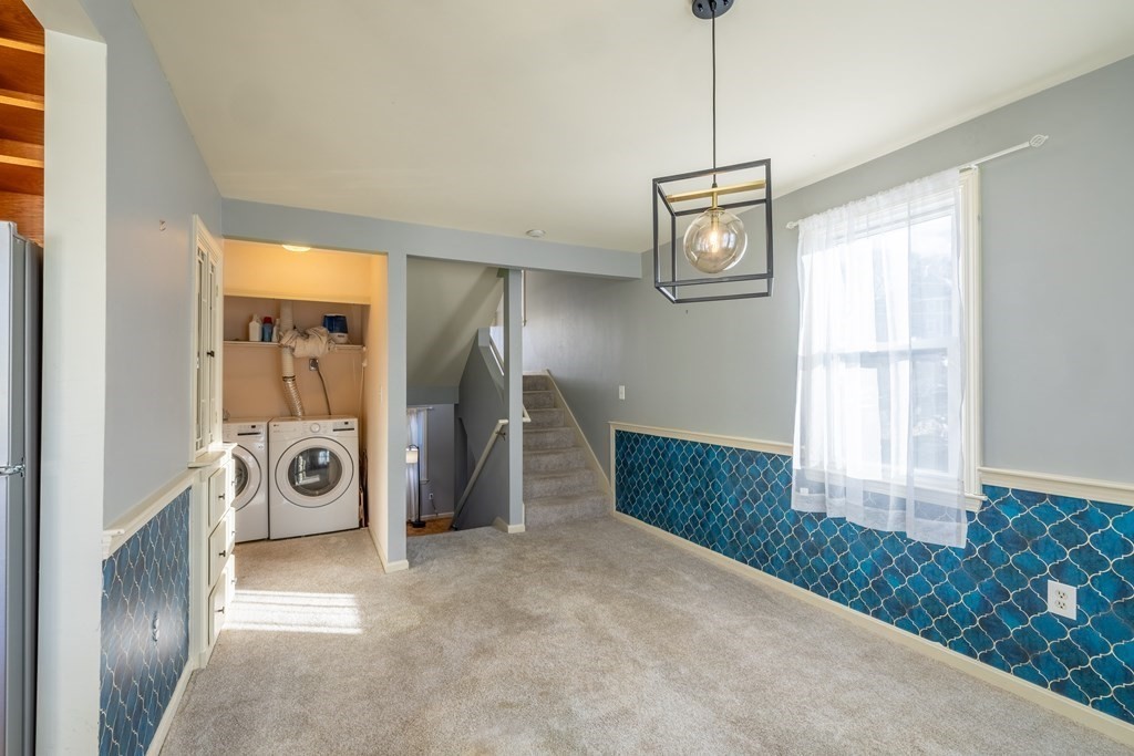 12 Pickett Street, Unit H Beverly, MA 01915 - Photo 12 of 31 a view of a livingroom with furniture and windows