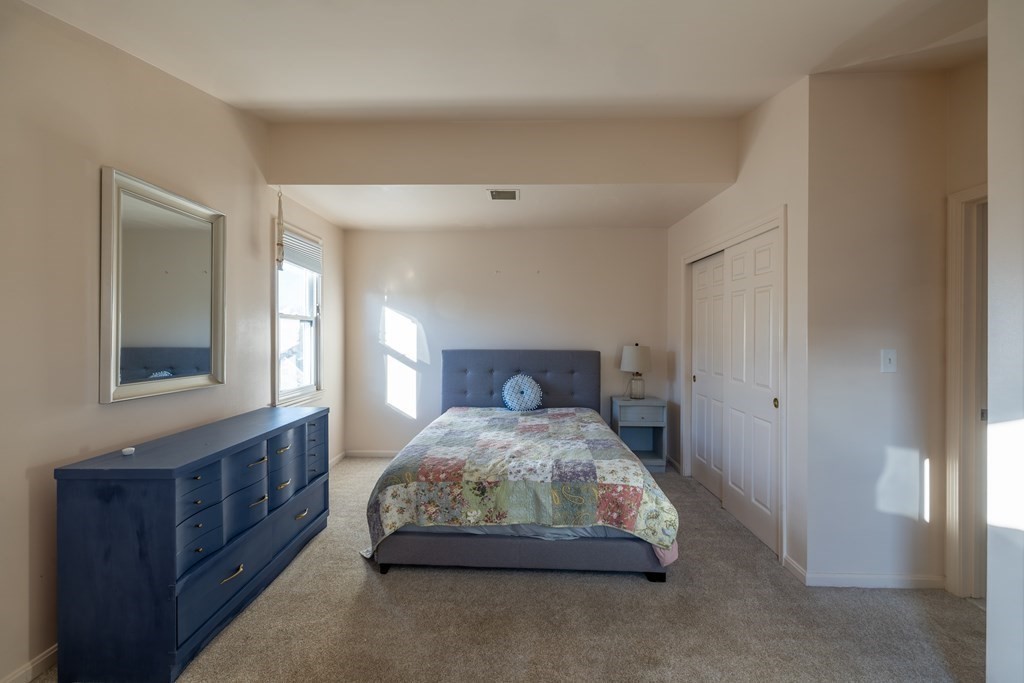 12 Pickett Street, Unit H Beverly, MA 01915 - Photo 23 of 31 a bedroom with a bed and window