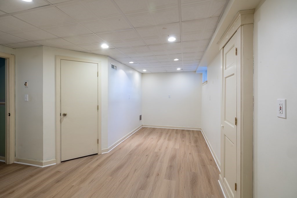 12 Pickett Street, Unit H Beverly, MA 01915 - Photo 28 of 31 a view of hallway with wooden floor