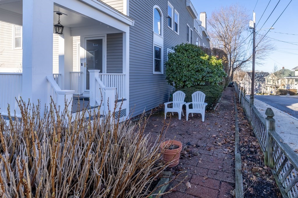 12 Pickett Street, Unit H Beverly, MA 01915 - Photo 29 of 31 a view of a backyard with chairs