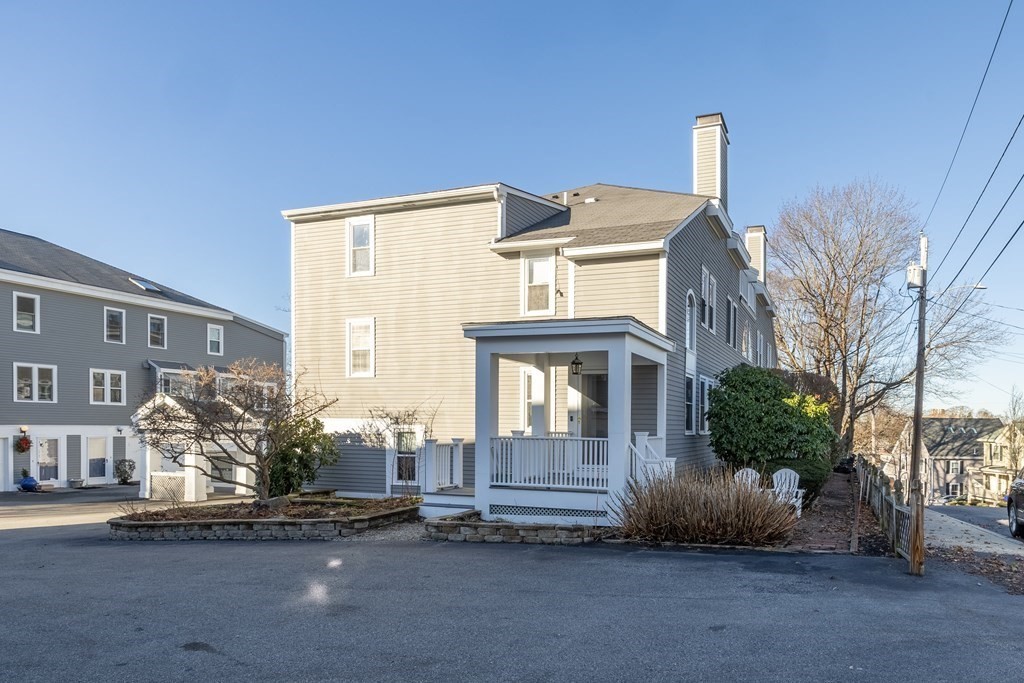12 Pickett Street, Unit H Beverly, MA 01915 - Photo 30 of 31 a front view of a house with a yard