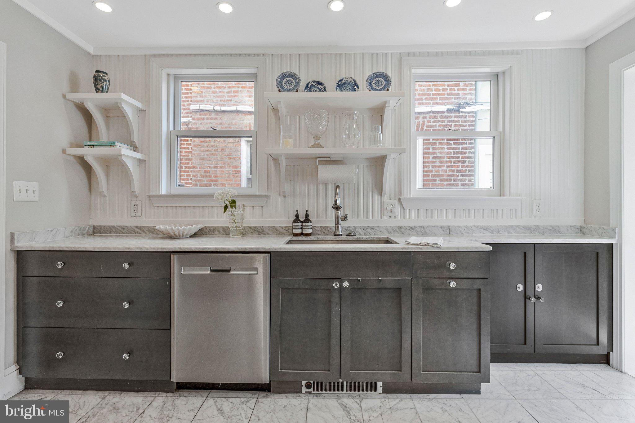 611 G Street Southeast Washington, DC 20003 - Photo 13 of 32 a kitchen with a sink cabinets and window