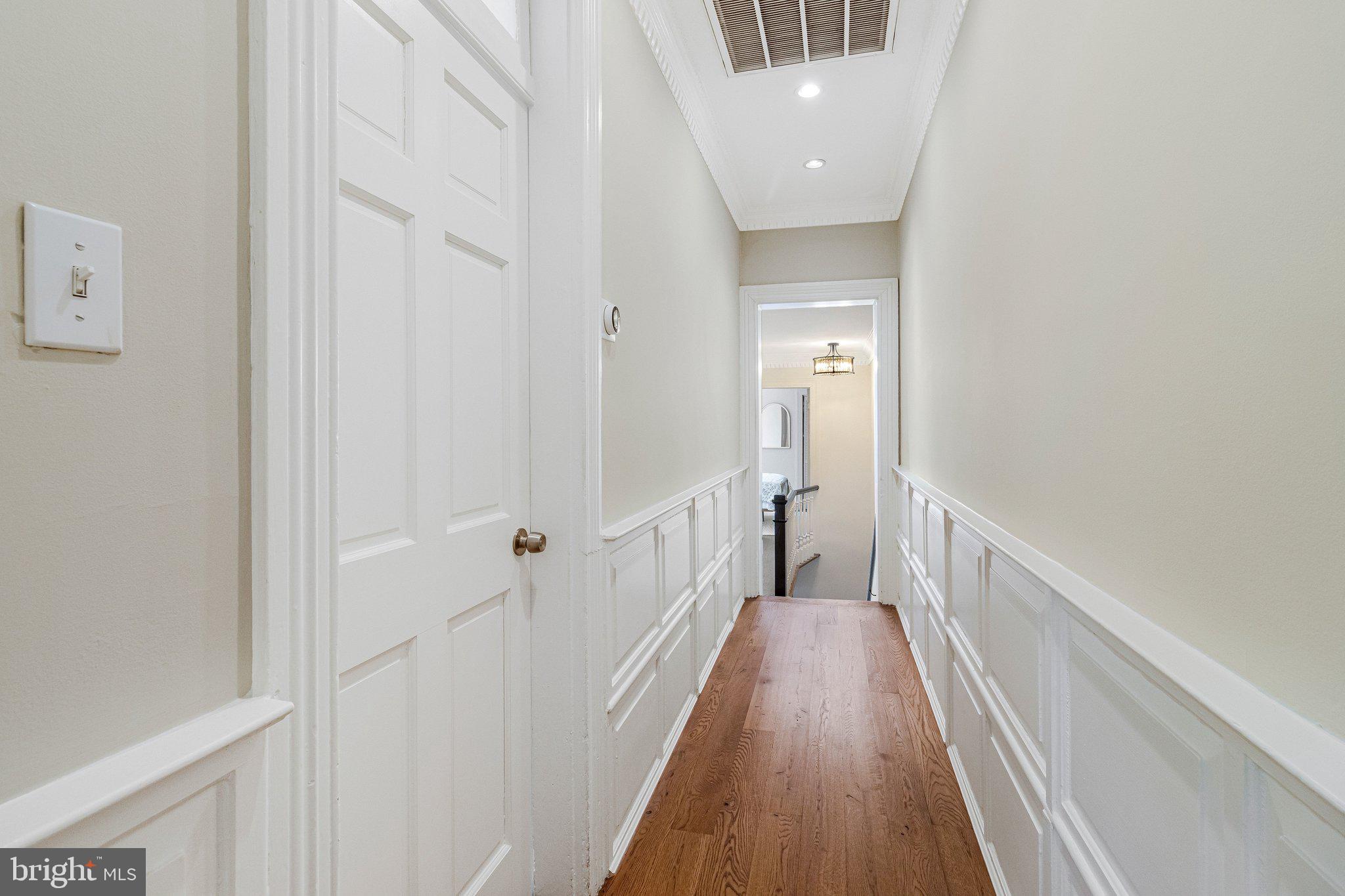 611 G Street Southeast Washington, DC 20003 - Photo 21 of 32 a view of a hallway with wooden floor