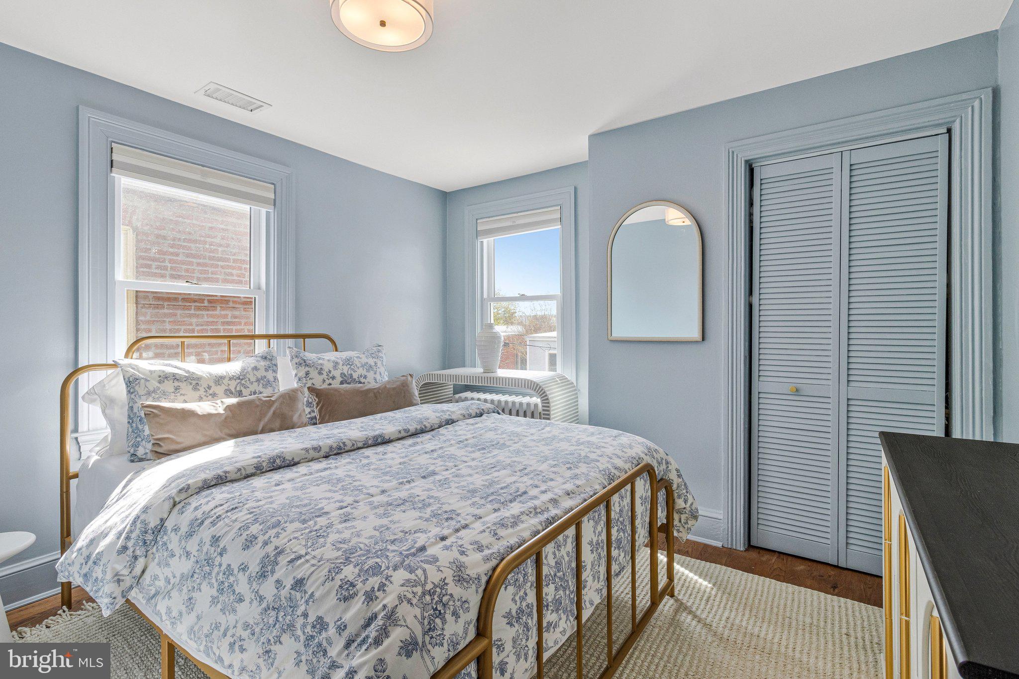 611 G Street Southeast Washington, DC 20003 - Photo 22 of 32 a bedroom with a bed and a window