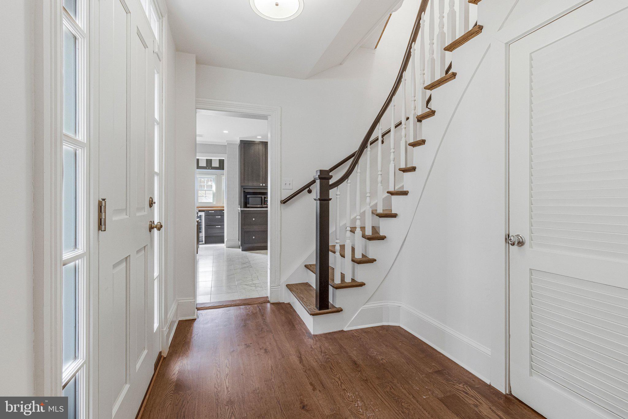 611 G Street Southeast Washington, DC 20003 - Photo 6 of 32 a view of entryway with wooden floor and stairs