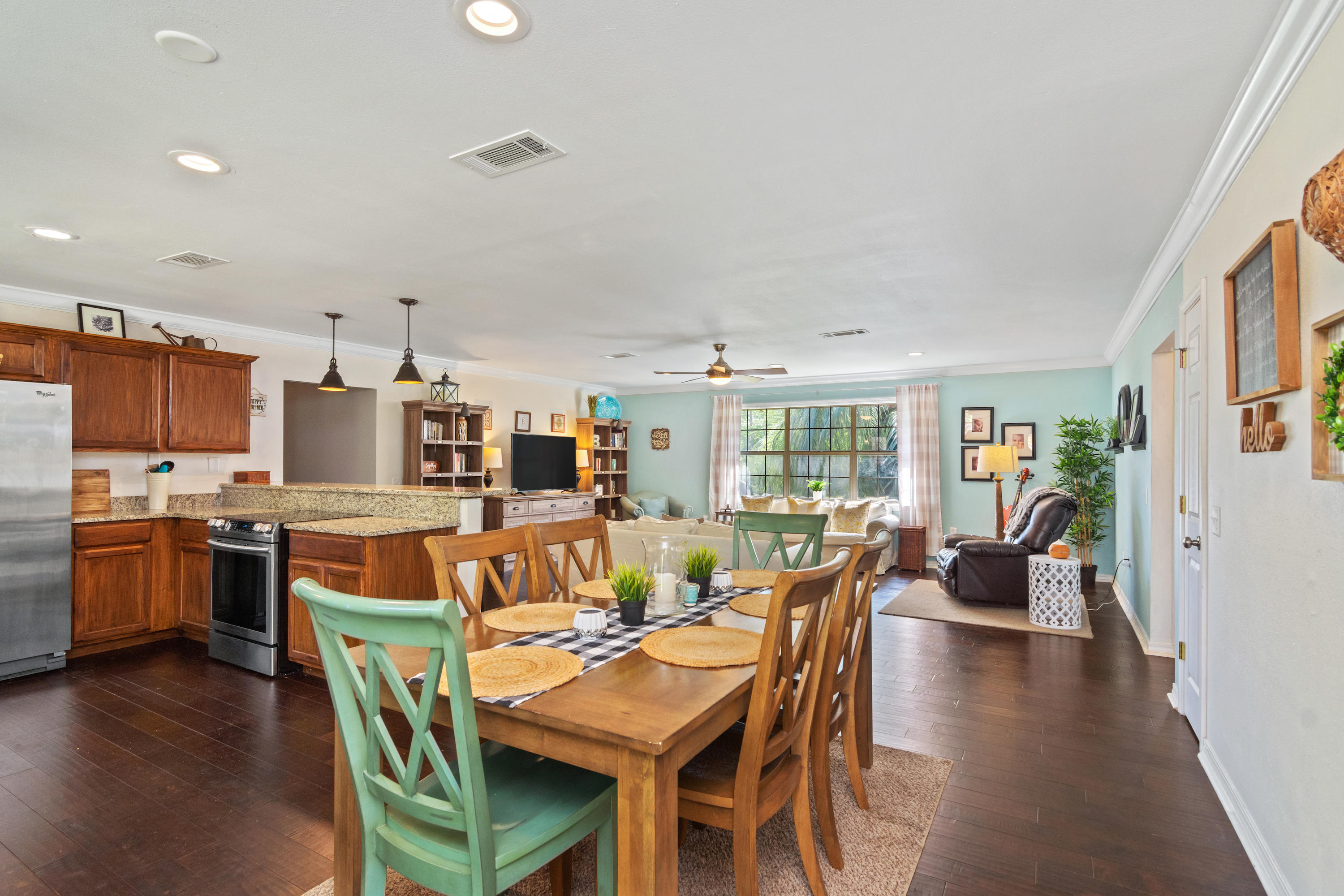 658 Ridge Lake Road Crestview, FL 32536 - Photo 13 of 47 a view of a dining room with furniture and wooden floor