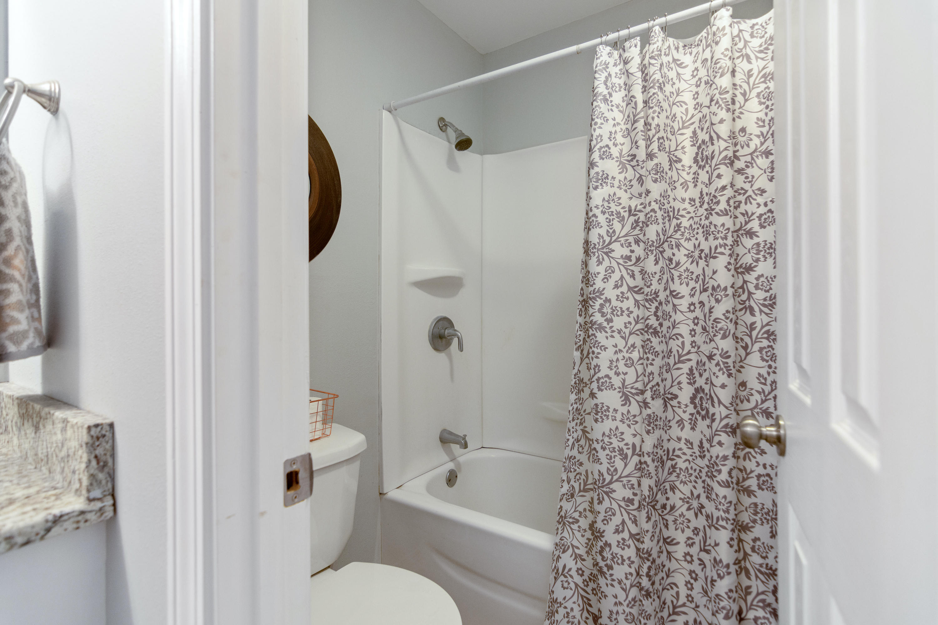 658 Ridge Lake Road Crestview, FL 32536 - Photo 24 of 47 a bathroom with a shower curtain and a toilet
