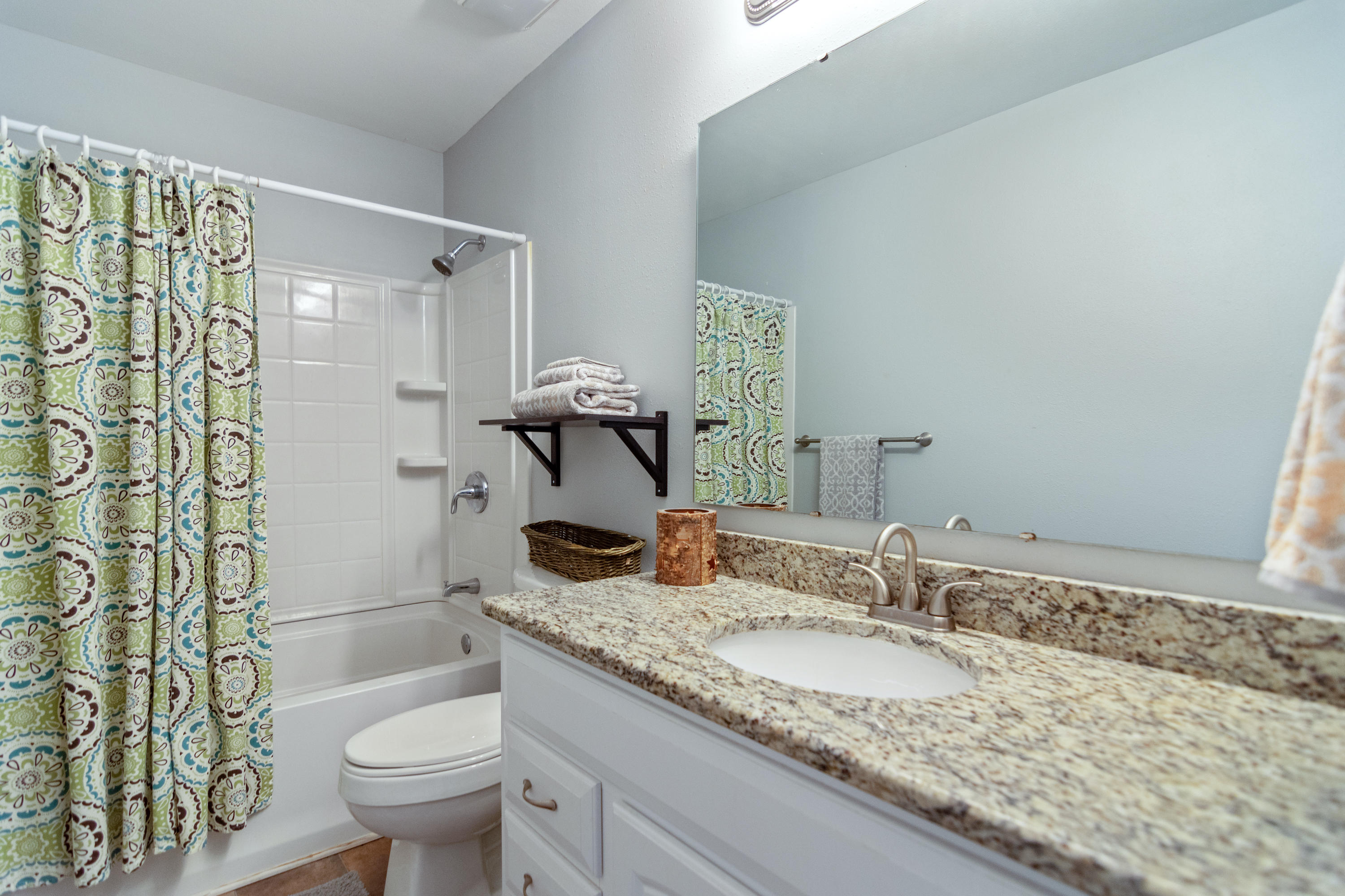 658 Ridge Lake Road Crestview, FL 32536 - Photo 30 of 47 a bathroom with a granite countertop sink and a mirror