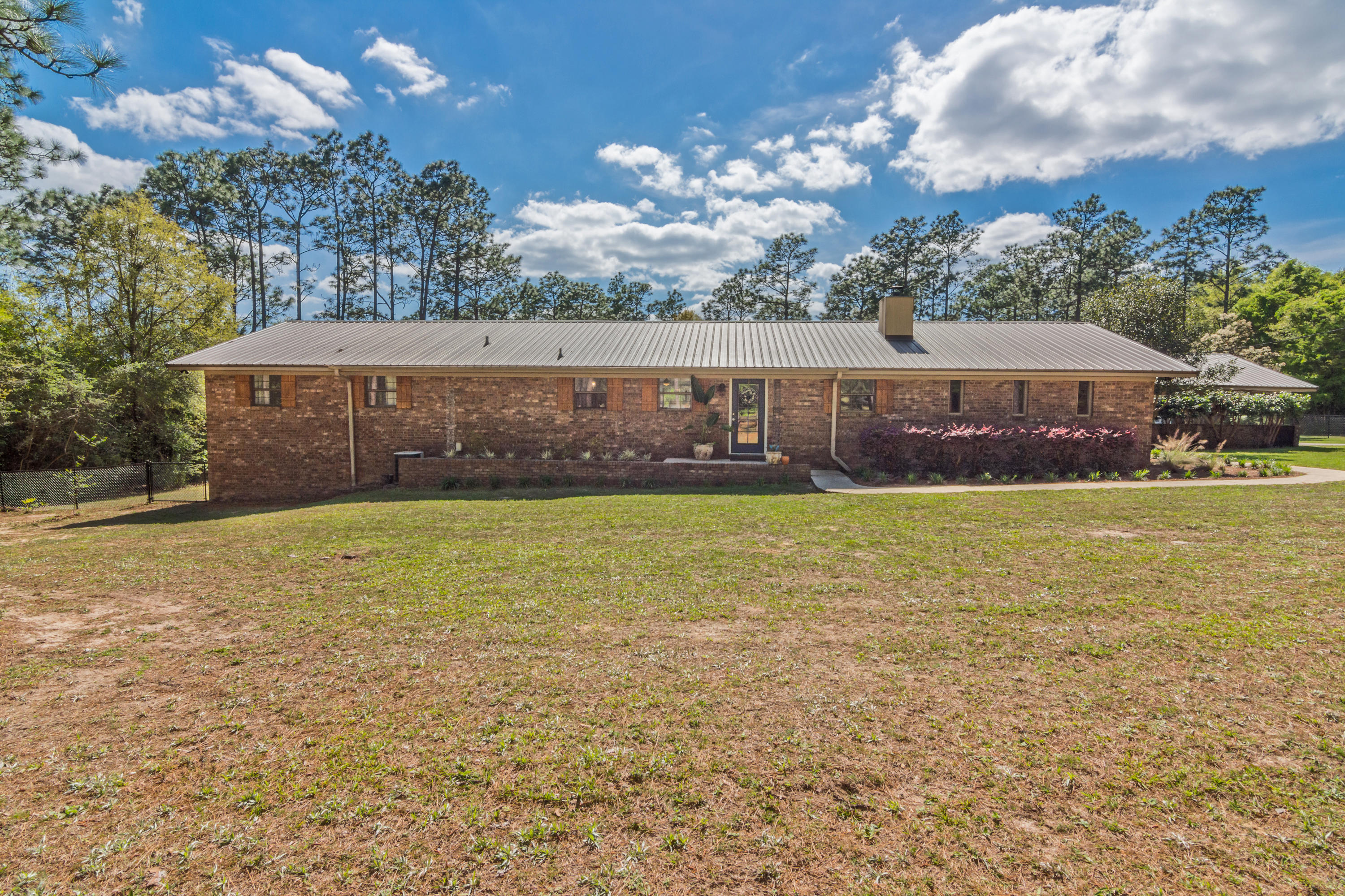 658 Ridge Lake Road Crestview, FL 32536 - Photo 3 of 47 a view of a house with a yard