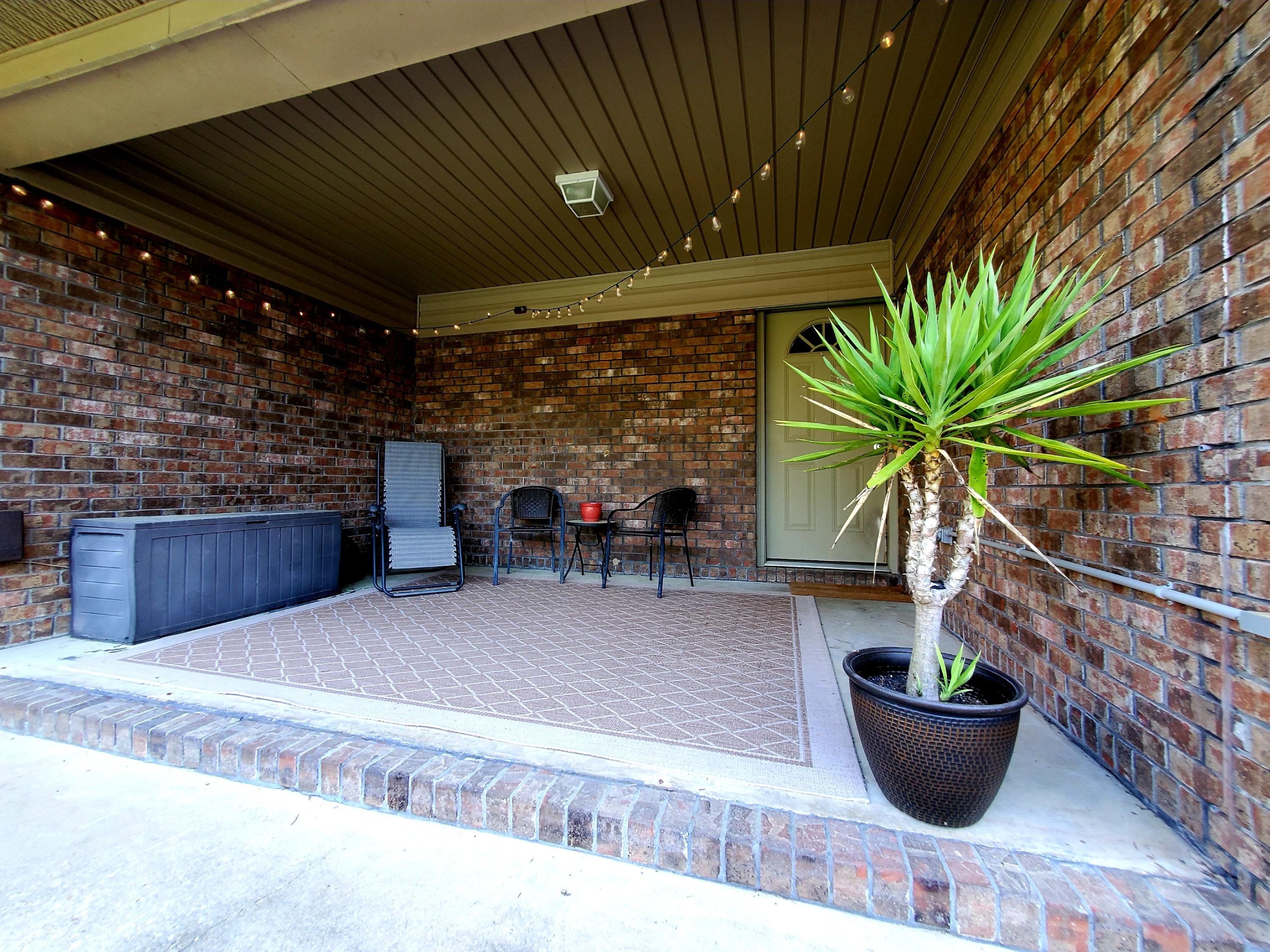 658 Ridge Lake Road Crestview, FL 32536 - Photo 34 of 47 a living room with furniture and potted plants