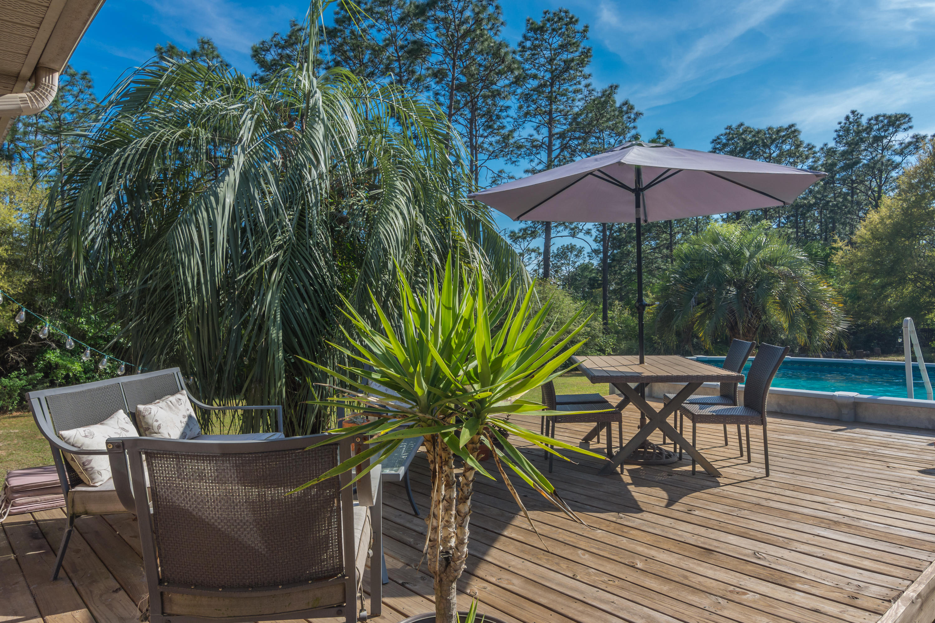 658 Ridge Lake Road Crestview, FL 32536 - Photo 37 of 47 a view of a backyard with sitting area