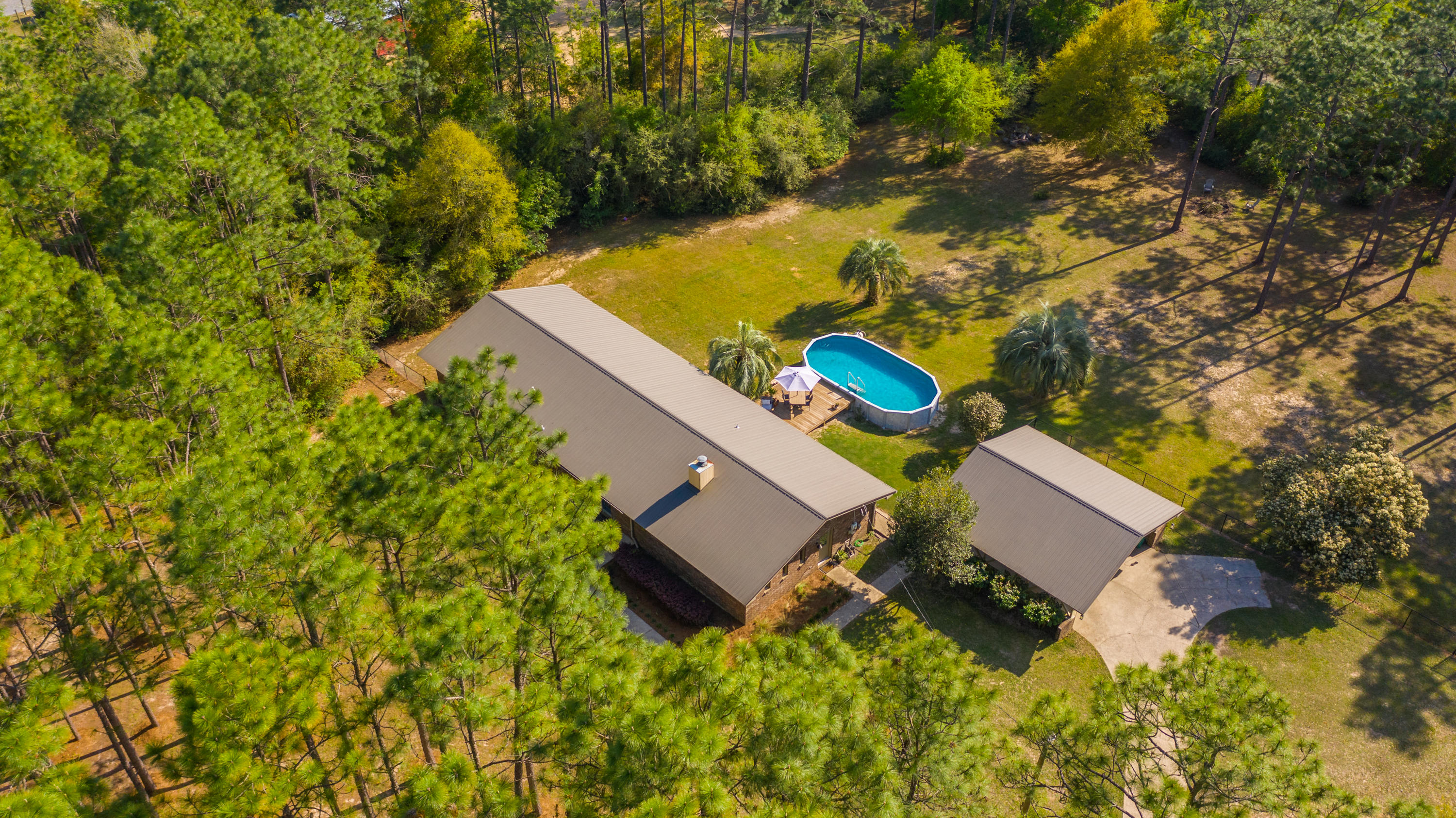 658 Ridge Lake Road Crestview, FL 32536 - Photo 44 of 47 an aerial view of a house with a yard and lake view