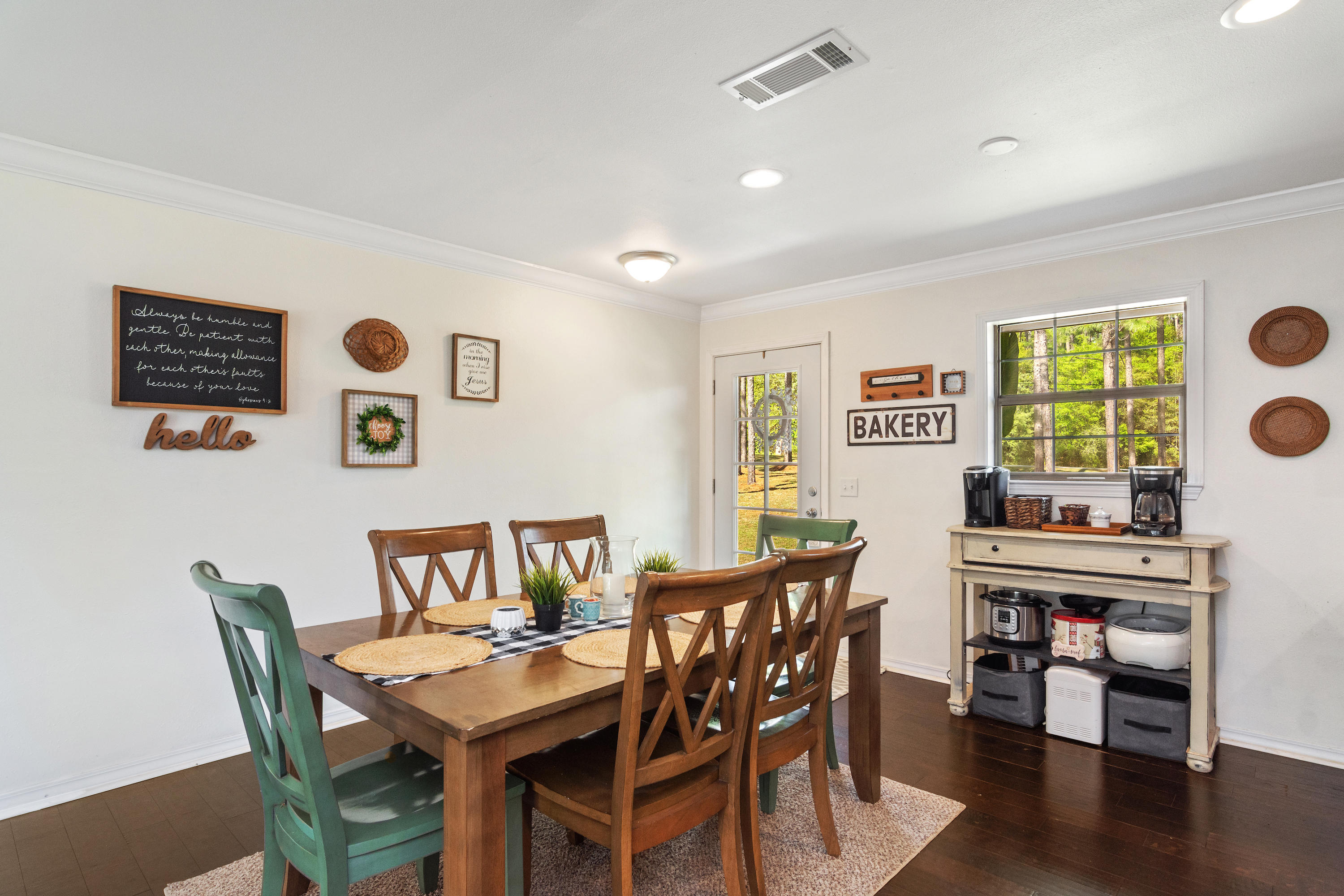 658 Ridge Lake Road Crestview, FL 32536 - Photo 7 of 47 a view of a dining room with furniture and wooden floor