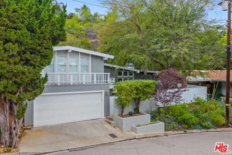 front view of a house with a small yard