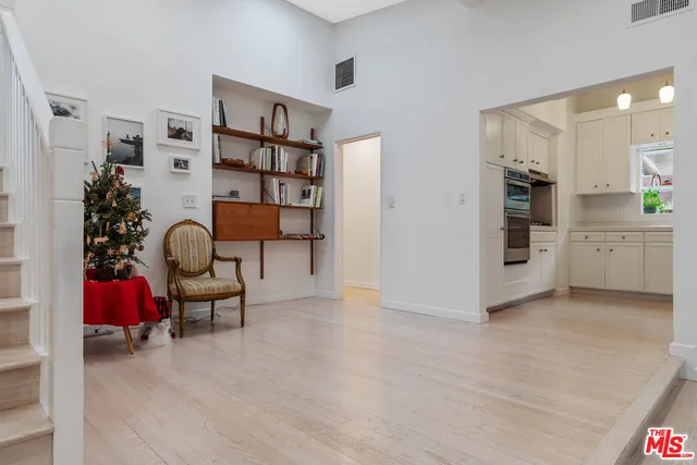 a hallway with furniture and white walls