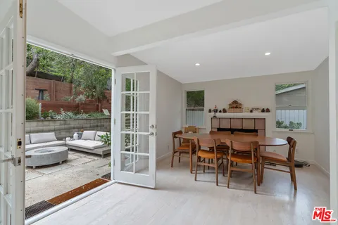a bedroom with furniture and a book shelf