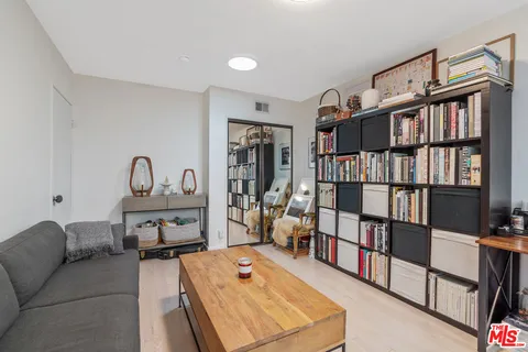 a living room with furniture and windows