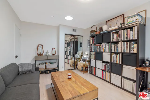 a living room with furniture and windows