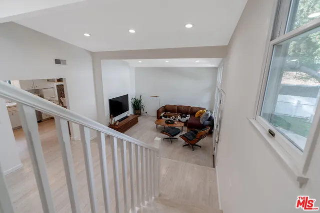 a view of a patio with couches chairs and a yard