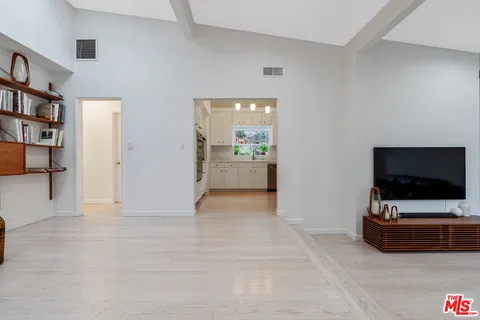 a kitchen with a refrigerator sink and stove