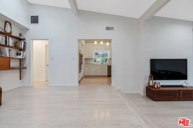 a kitchen with a refrigerator sink and stove