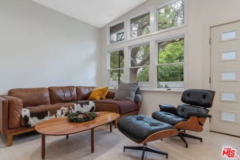 a living room with furniture and window