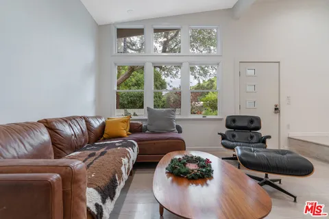 a view of a livingroom with furniture and toys